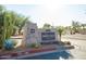 Stone community center sign with desert landscaping and clear street access at 34457 N Legend Trail Pkwy # 1013, Scottsdale, AZ 85262