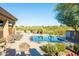 Well-maintained community pool with lounge chairs and beautiful desert views at 34457 N Legend Trail Pkwy # 1013, Scottsdale, AZ 85262