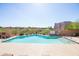 A well-maintained community pool with visible safety instructions and clear blue water at 34457 N Legend Trail Pkwy # 1013, Scottsdale, AZ 85262
