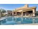 Resort-style community pool with comfortable lounge chairs and shaded seating at 34457 N Legend Trail Pkwy # 1013, Scottsdale, AZ 85262