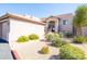 Exterior view with xeriscaping and cactus, and building with stairs and an entryway at 34457 N Legend Trail Pkwy # 1013, Scottsdale, AZ 85262