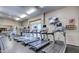 Fully equipped gym features treadmills, fitness equipment, and a wall-mounted TV for a complete workout experience at 34457 N Legend Trail Pkwy # 1013, Scottsdale, AZ 85262