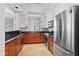 Updated kitchen featuring stainless steel appliances, granite countertops, and tiled floor at 34457 N Legend Trail Pkwy # 1013, Scottsdale, AZ 85262