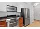 Bright kitchen with stainless steel appliances and wood cabinets for a modern cooking experience at 34457 N Legend Trail Pkwy # 1013, Scottsdale, AZ 85262
