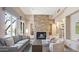 This is a living room with a fireplace, a sofa, chairs and other nice interior design elements at 34457 N Legend Trail Pkwy # 1013, Scottsdale, AZ 85262