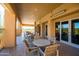 This is a lovely outdoor patio with dining tables and chairs perfect for relaxing with friends and Gathering at 34457 N Legend Trail Pkwy # 1013, Scottsdale, AZ 85262