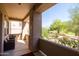 Inviting covered patio with comfortable seating and a beautiful desert landscape view at 34457 N Legend Trail Pkwy # 1013, Scottsdale, AZ 85262