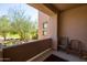 View of a quaint outdoor patio with a neutral color palette and desert views at 34457 N Legend Trail Pkwy # 1013, Scottsdale, AZ 85262