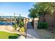 Tennis court area surrounded by lush landscaping and cacti at 34457 N Legend Trail Pkwy # 1013, Scottsdale, AZ 85262