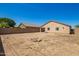 Backyard featuring a rock firepit and desert landscaping at 34463 N Karan Swiss Cir, San Tan Valley, AZ 85143