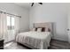 Comfortable bedroom with a large window providing natural light at 34463 N Karan Swiss Cir, San Tan Valley, AZ 85143
