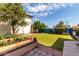 Lush backyard featuring a well-manicured lawn, and mature trees, perfect for outdoor entertaining at 3730 W Michigan Ave, Glendale, AZ 85308