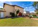 Spacious backyard showcasing a well-maintained lawn, mature trees and a flower garden at 3730 W Michigan Ave, Glendale, AZ 85308