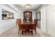 Formal dining room featuring a wooden table, chairs, and a decorative hutch for elegant Gathering dinners at 3730 W Michigan Ave, Glendale, AZ 85308