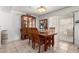 Charming dining area featuring tile floors, sliding glass doors, and a decorative hutch for storage at 3730 W Michigan Ave, Glendale, AZ 85308