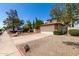 Charming home showcasing a two car garage, low maintenance landscaping, and a long driveway at 3730 W Michigan Ave, Glendale, AZ 85308