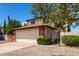 Two story home showcasing a two car garage, brick accents, and well maintained landscaping at 3730 W Michigan Ave, Glendale, AZ 85308