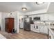 Bright kitchen with white cabinetry, stainless steel appliances, and an open layout for modern living at 3730 W Michigan Ave, Glendale, AZ 85308