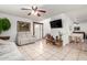 Inviting living room with neutral tile flooring, comfortable seating, and an open floorplan at 3730 W Michigan Ave, Glendale, AZ 85308