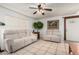 Inviting living room with tile flooring, comfortable seating and a ceiling fan at 3730 W Michigan Ave, Glendale, AZ 85308