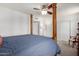 Spacious bedroom with a four-poster bed, ceiling fan, and ample storage space for comfortable living at 3730 W Michigan Ave, Glendale, AZ 85308