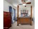 Inviting bedroom with a four-poster bed, soft blue accents, and a ceiling fan for comfortable living at 3730 W Michigan Ave, Glendale, AZ 85308