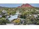 Expansive estate with lush greenery and a serene pool area with views of Camelback Mountain at 3901 E San Miguel Ave, Paradise Valley, AZ 85253