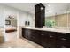 Stylish bathroom featuring a large vanity with dual sinks and doorway leading to bedroom at 3901 E San Miguel Ave, Paradise Valley, AZ 85253