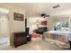 Cozy bedroom with access to the backyard, a ceiling fan, and an en-suite bathroom at 3901 E San Miguel Ave, Paradise Valley, AZ 85253