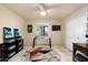 Inviting room with neutral walls, sleek desk, and a ceiling fan for added comfort at 3901 E San Miguel Ave, Paradise Valley, AZ 85253