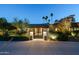 Charming front gate with wrought iron accents, landscape lighting, and manicured greenery at 3901 E San Miguel Ave, Paradise Valley, AZ 85253