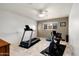 Fitness room with modern exercise equipment, a ceiling fan, and natural light from a window at 3901 E San Miguel Ave, Paradise Valley, AZ 85253