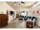 Spacious living area featuring tile floors, large windows, TV, and comfortable seating at 3901 E San Miguel Ave, Paradise Valley, AZ 85253