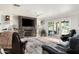 Cozy living room featuring a fireplace, plush seating, and sliding doors to the outdoor patio at 3901 E San Miguel Ave, Paradise Valley, AZ 85253