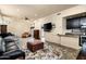 Spacious living room with dark cabinets, modern lighting, and comfortable seating, perfect for entertaining at 3901 E San Miguel Ave, Paradise Valley, AZ 85253