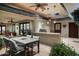 Charming outdoor kitchen with a built-in grill and spacious dining area under a covered patio at 3901 E San Miguel Ave, Paradise Valley, AZ 85253