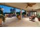 Expansive covered patio area with ample seating, lush landscaping, and seamless indoor-outdoor living at 3901 E San Miguel Ave, Paradise Valley, AZ 85253