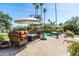 Inviting pool area with comfortable seating, shade umbrellas, and lush landscaping at 3901 E San Miguel Ave, Paradise Valley, AZ 85253