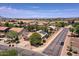 Aerial view of a single-Gathering home featuring solar panels in a desert community at 44182 W Juniper Ave, Maricopa, AZ 85138