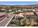 Beautiful single-Gathering home in a desirable neighborhood, showcasing mature trees, a trampoline, and well-maintained lawns at 44182 W Juniper Ave, Maricopa, AZ 85138