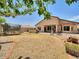 Spacious backyard with patio and mature landscaping, perfect for outdoor living at 44182 W Juniper Ave, Maricopa, AZ 85138