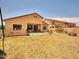 Large backyard with covered patio, grill and manicured landscaping at 44182 W Juniper Ave, Maricopa, AZ 85138