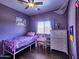 Stylish bedroom with ceiling fan, window, and decorative accessories at 44182 W Juniper Ave, Maricopa, AZ 85138