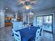 Open floor plan seamlessly connects the dining room, kitchen, and outdoor patio at 44182 W Juniper Ave, Maricopa, AZ 85138