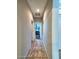 Hallway offering a clear view into the bedroom and main entrance at 44182 W Juniper Ave, Maricopa, AZ 85138