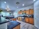 Well-equipped kitchen featuring oak cabinets and stainless steel appliances at 44182 W Juniper Ave, Maricopa, AZ 85138