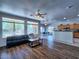 Bright living space featuring an open floorplan and large windows for natural light at 44182 W Juniper Ave, Maricopa, AZ 85138
