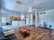 Bright and airy living area showcases the open layout and access to the kitchen at 44182 W Juniper Ave, Maricopa, AZ 85138