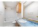 Bathroom with a shower-tub, vanity, large mirror, and overhead cabinet storage at 49039 N 24Th Ave, New River, AZ 85087