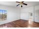 Light-filled bedroom with laminate flooring and an ensuite bathroom at 49039 N 24Th Ave, New River, AZ 85087